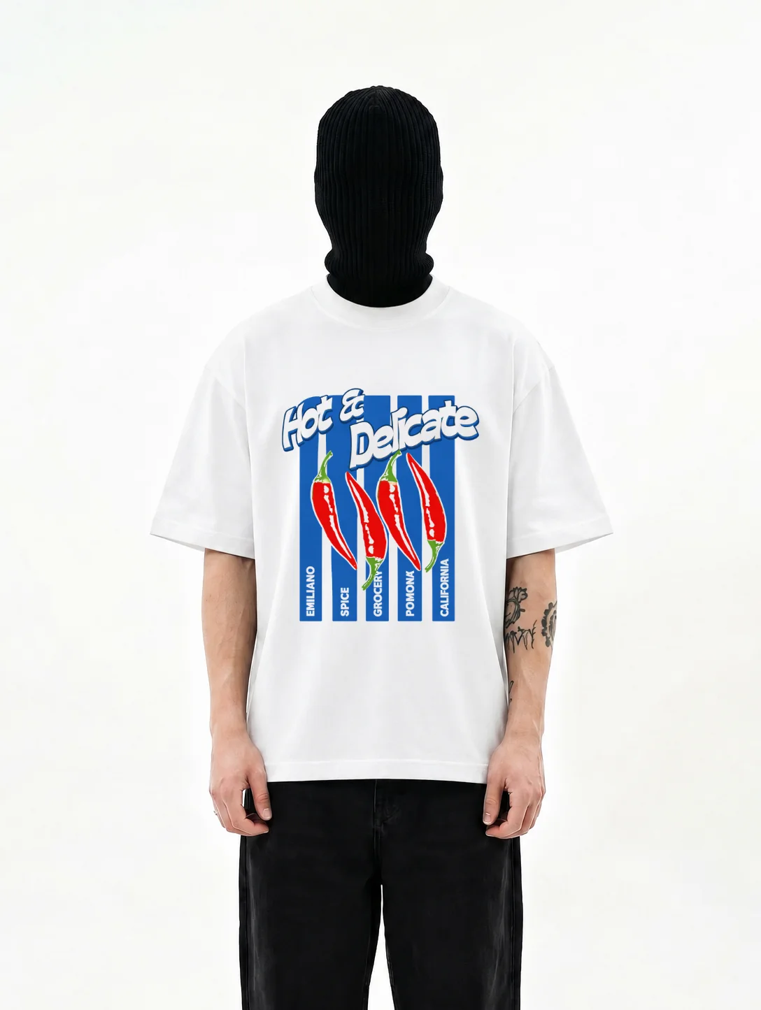 Hot & Delicate oversized t-shirt in white, four-colour chilli print across the chest on a cobalt field