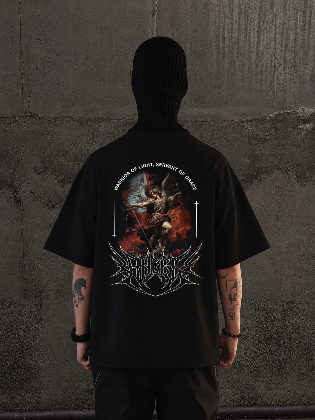 Morningstar oversized t-shirt in black, archangel back print reading messenger of light, servant of grace